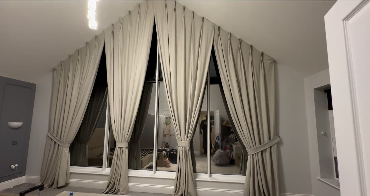 Apex curtains following two roof slopes