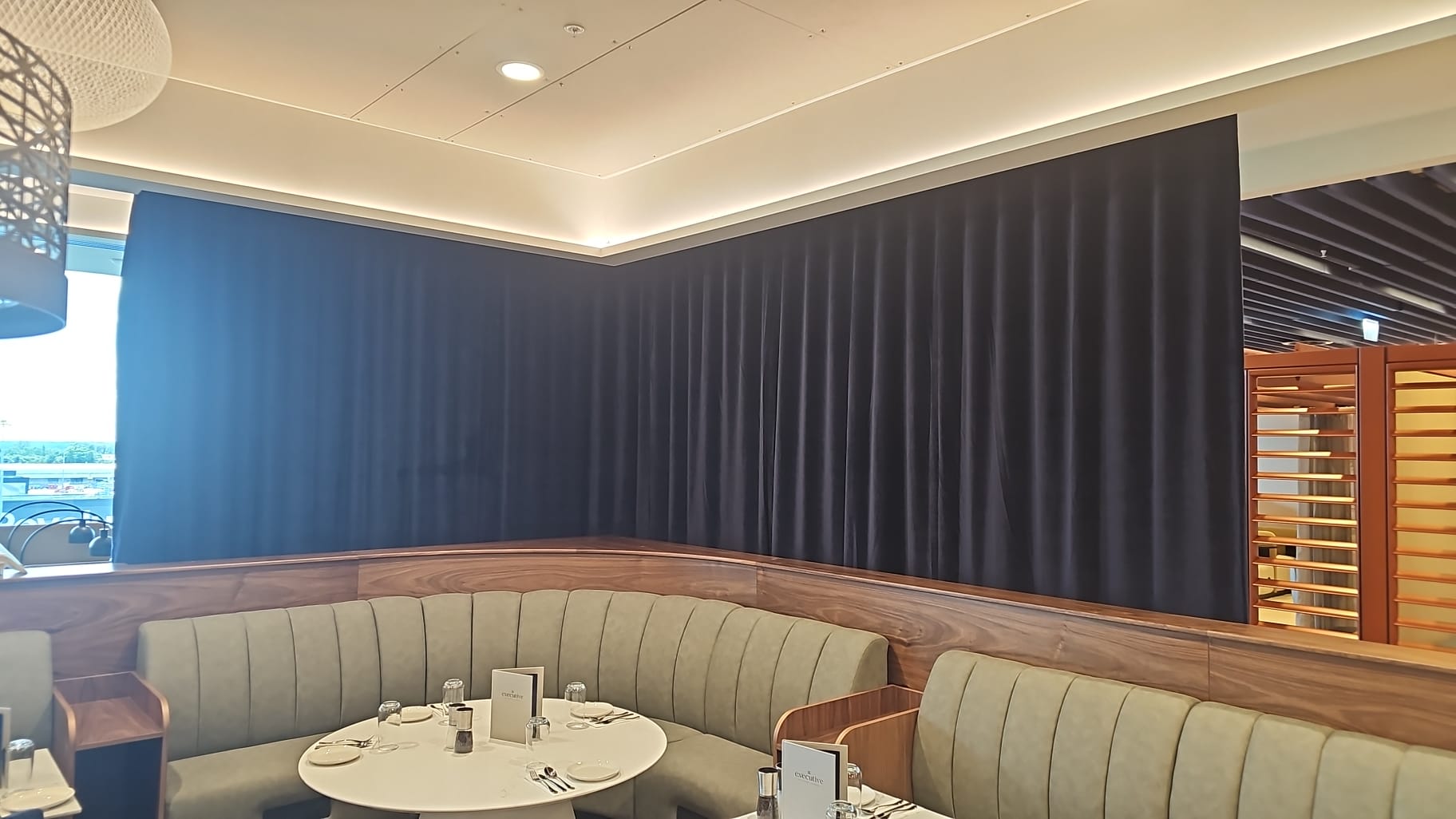 Commercial curtain and track installation at Manchester Airport lounge