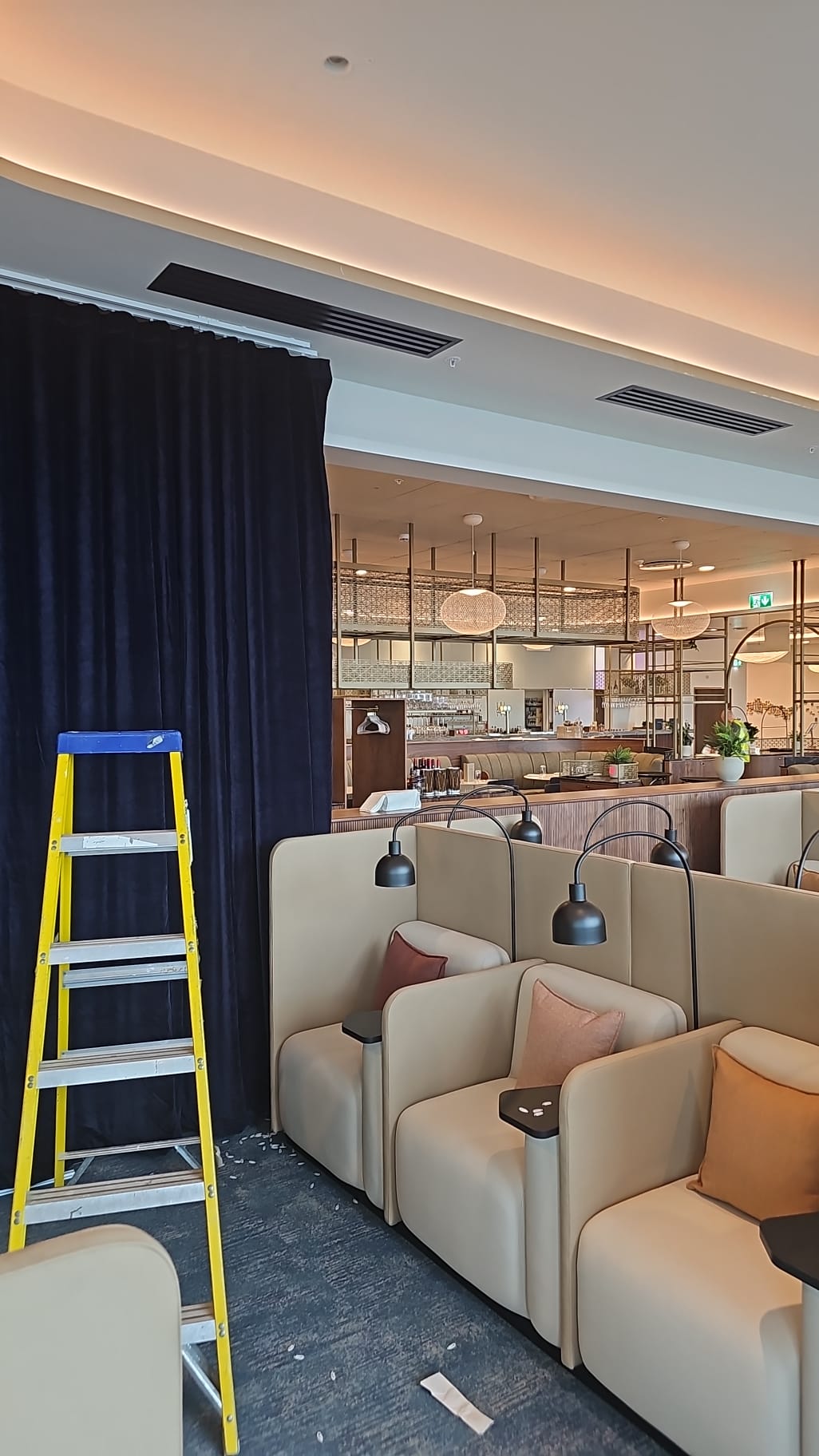 Ceiling-mounted curtain track detail at Manchester Airport lounge